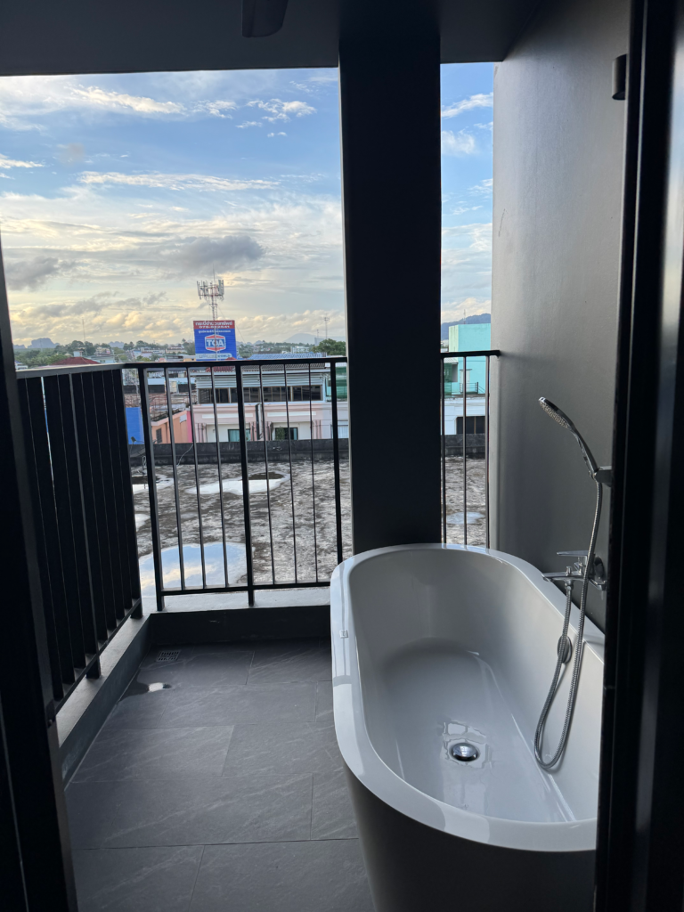 Bathroom and terrace bathtub in the Deluxe Room at Blue Monkey Hub & Hotel Krabi Town
